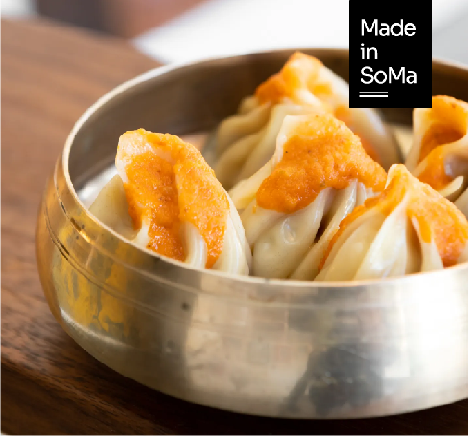 A plate of handmade momos can feel simple—until you understand what it carries. At Bini's Kitchen in SoMa, those dumplings represent far more than a meal. They reflect the journey of chef Binita Pradhan, who rebuilt her life from the ground up and, in the process, introduced San Francisco to one of Nepal’s most beloved street foods. Located at 100 Morris Street, her kitchen has become a steady presence in the neighborhood, shaped as much by personal history as by tradition.